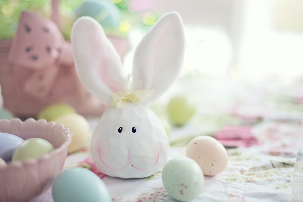 white-rabbit-figurine-on-white-and-pink-floral-textile-3979241
