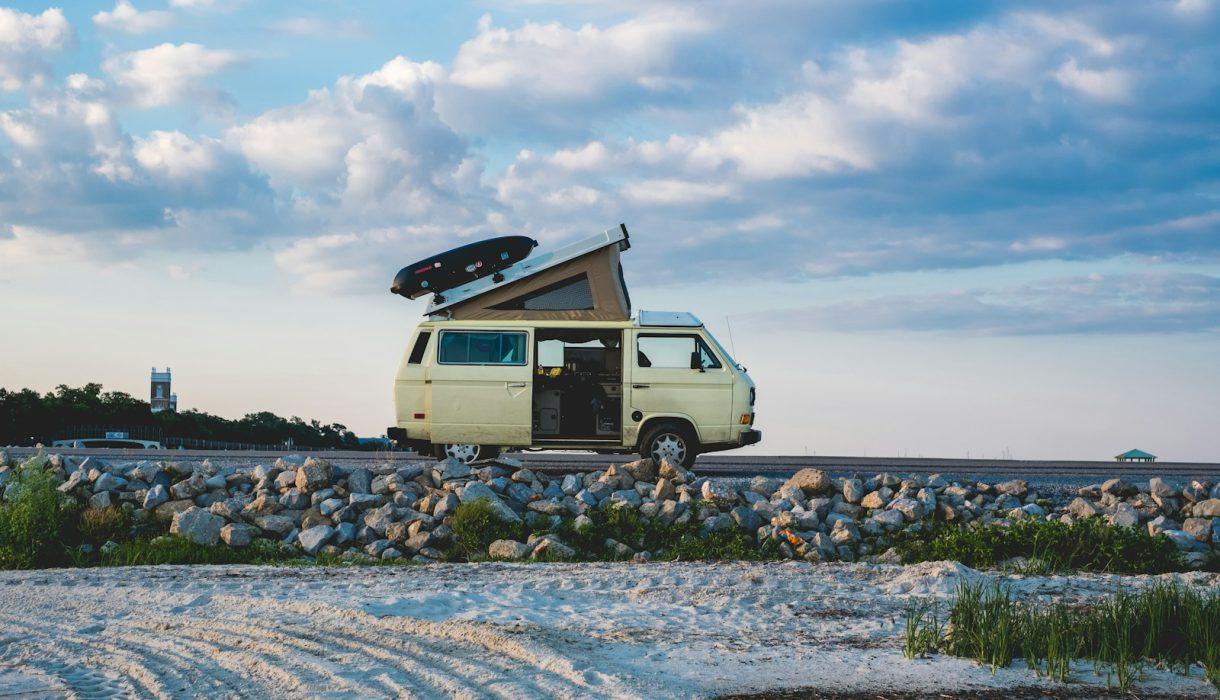 white van under cloudy sky during daytime